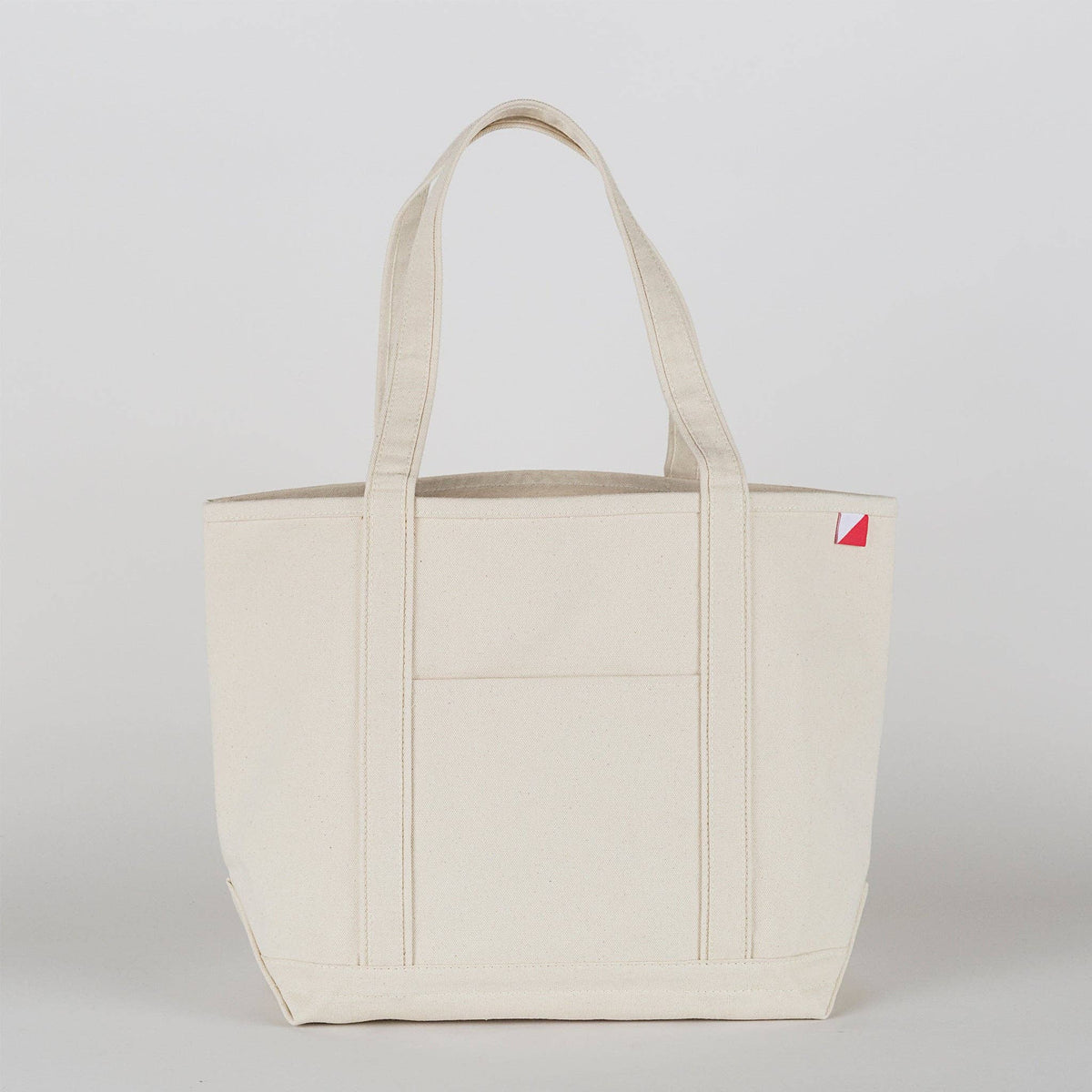The tote in all natural canvas with no contrast trim, shown from the front.