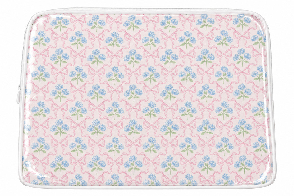 Pink cosmetic case with blue flowers and bows