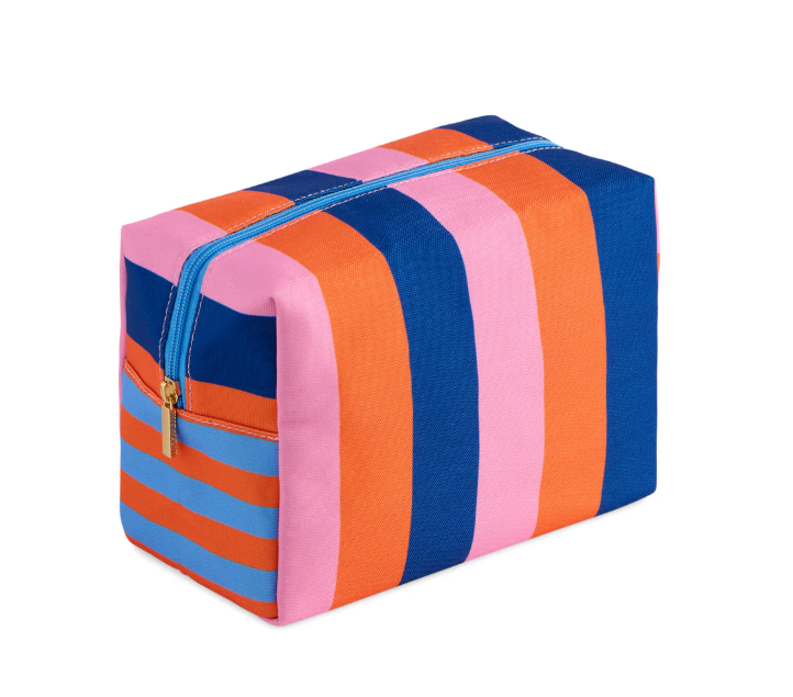 Boxy zipper pouch with wide navy, orange, and pink stripes, a blue zipper, and a gold zip pull