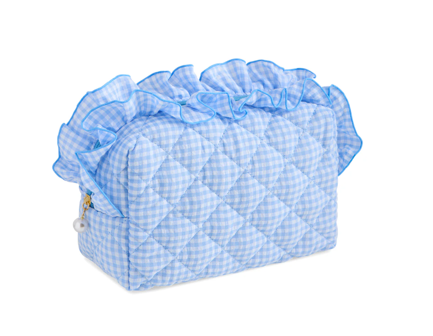 Blue gingham quilted pouch with a blue ruffle along the top zip