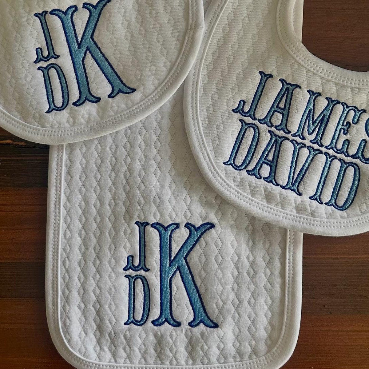 Baby bibs monogrammed with initials and a full name