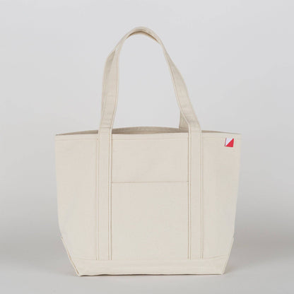 The tote in all natural canvas with no contrast trim, shown from the front.