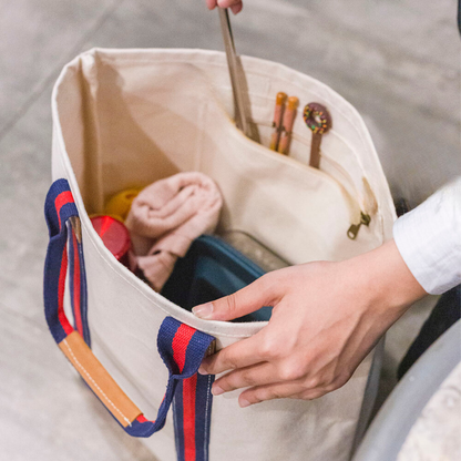 Open tote showing the interior with a slip pocket and items inside