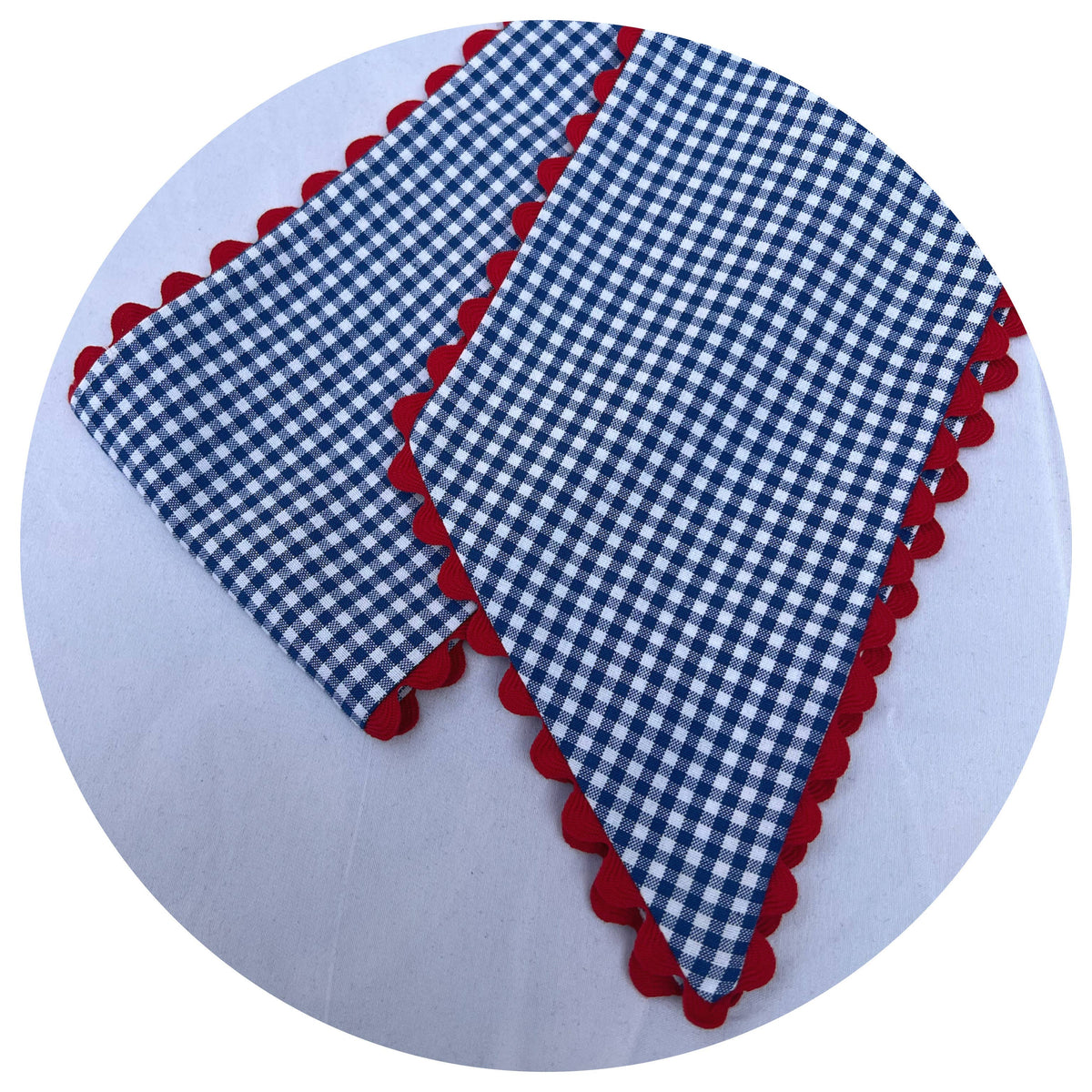 Royal blue gingham wreath sash with red ric rac trim on the edges