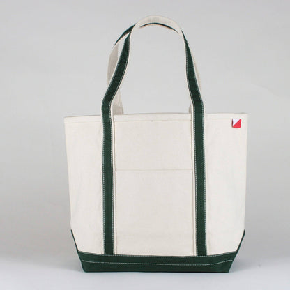 Natural canvas tote with hunter green straps, trim, and base, shown from the front