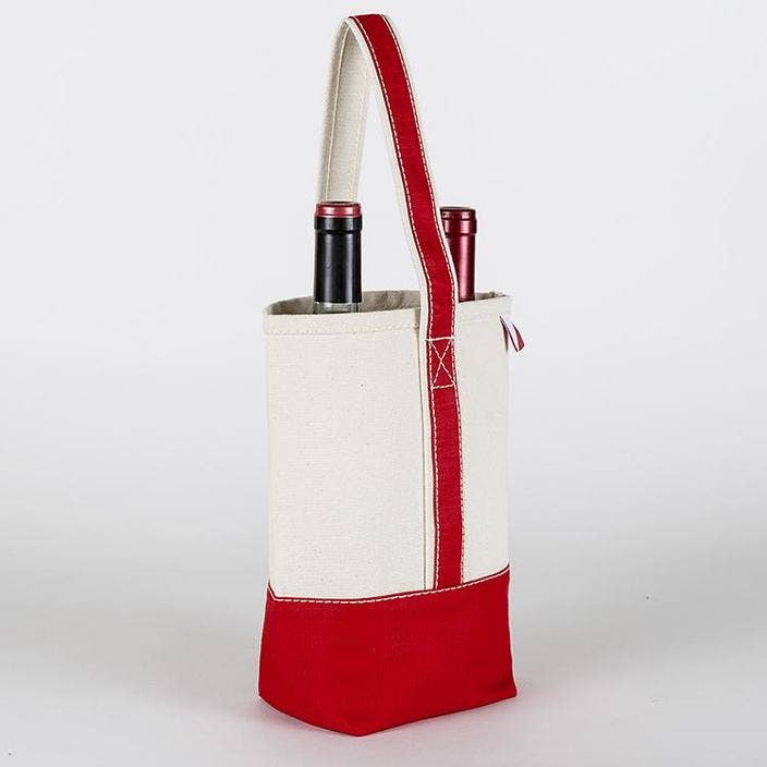 Natural and red canvas double wine bag on a table next to red flowers