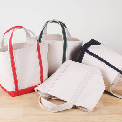 Mini natural canvas tote with cobalt blue handles and bottom