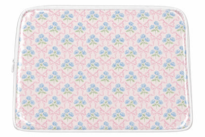 Pink cosmetic case with blue flowers and bows