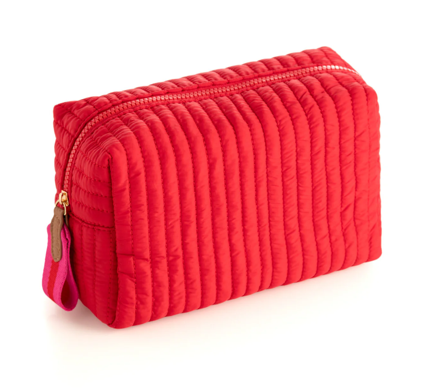 Red quilted zipper pouch with vertical channels and a red zip pull