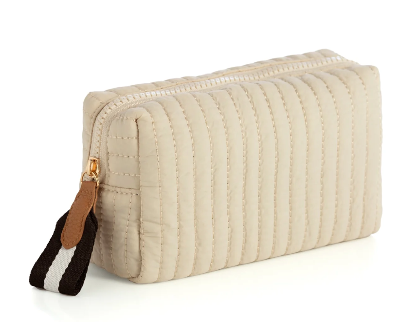 Beige quilted zipper pouch with a brown and striped zip pull