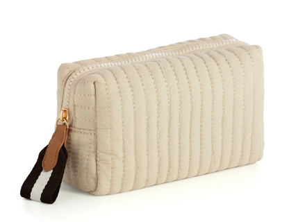 Beige quilted zipper pouch with a brown and striped zip pull
