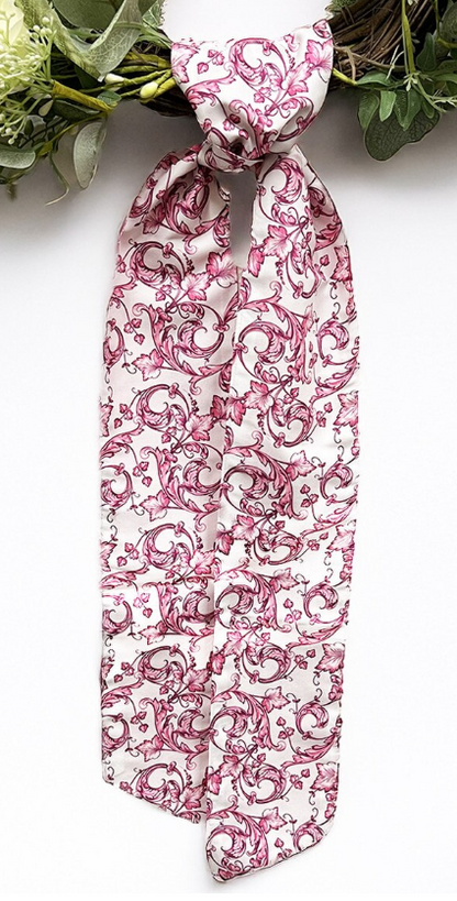 Patterned wreath sash in a pink and white scroll pattern